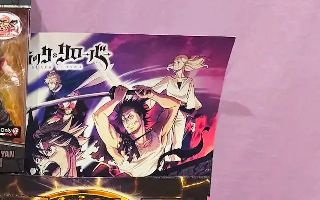 Anime posters, including Black Clover
